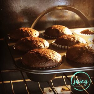 moist chocolate cupcakes baking in the oven