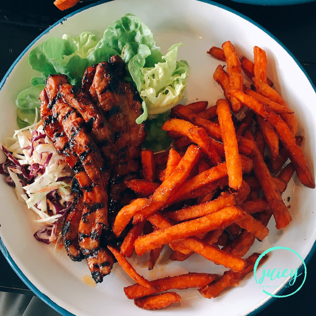 Burger Point's BBQ port with side of sweet potato fries served on a white circle plate